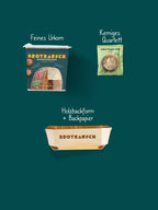 Inhalt Mitbringsel Geschenkbox S: Feines Urkorn, Topping Kerniges Quartett und Holzbackform mit Backpapier