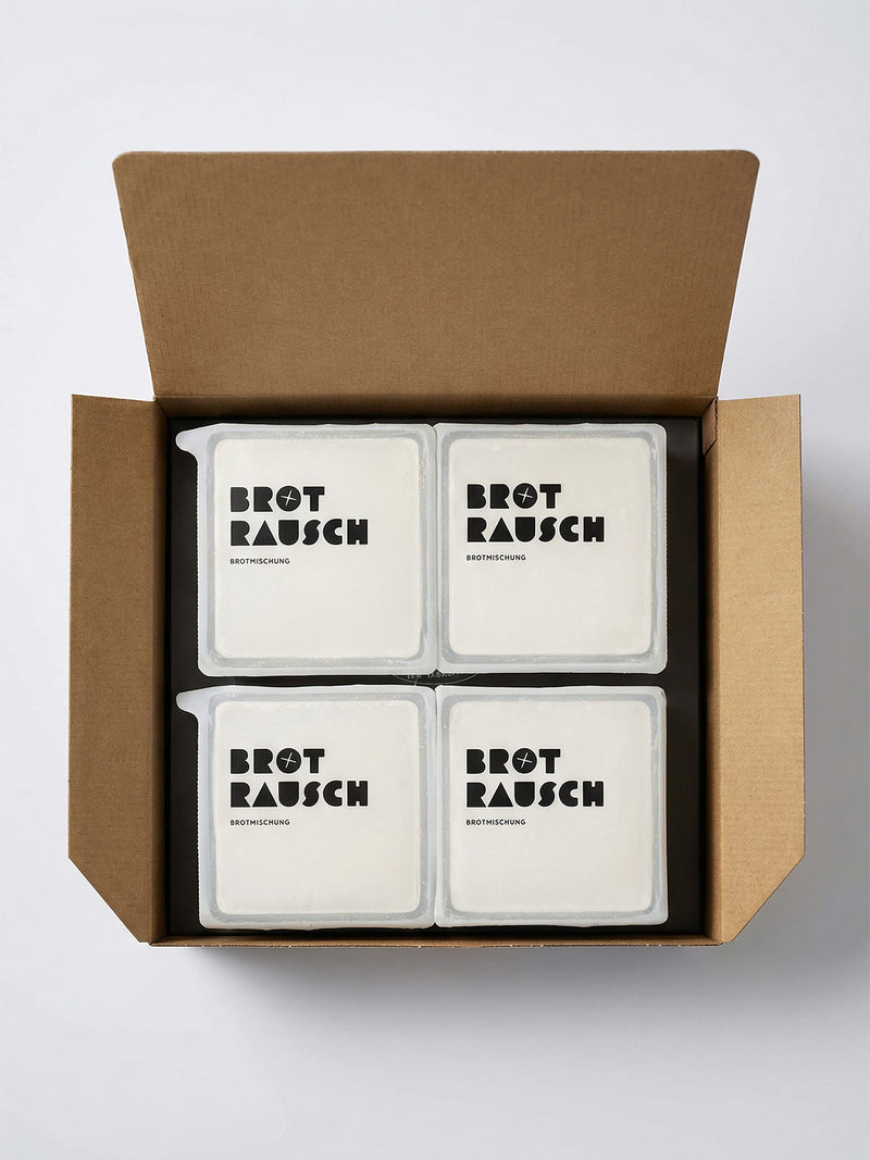 Vier Brotrausch Geschenkboxen im geöffneten Versandkarton, ideal als Firmengeschenk