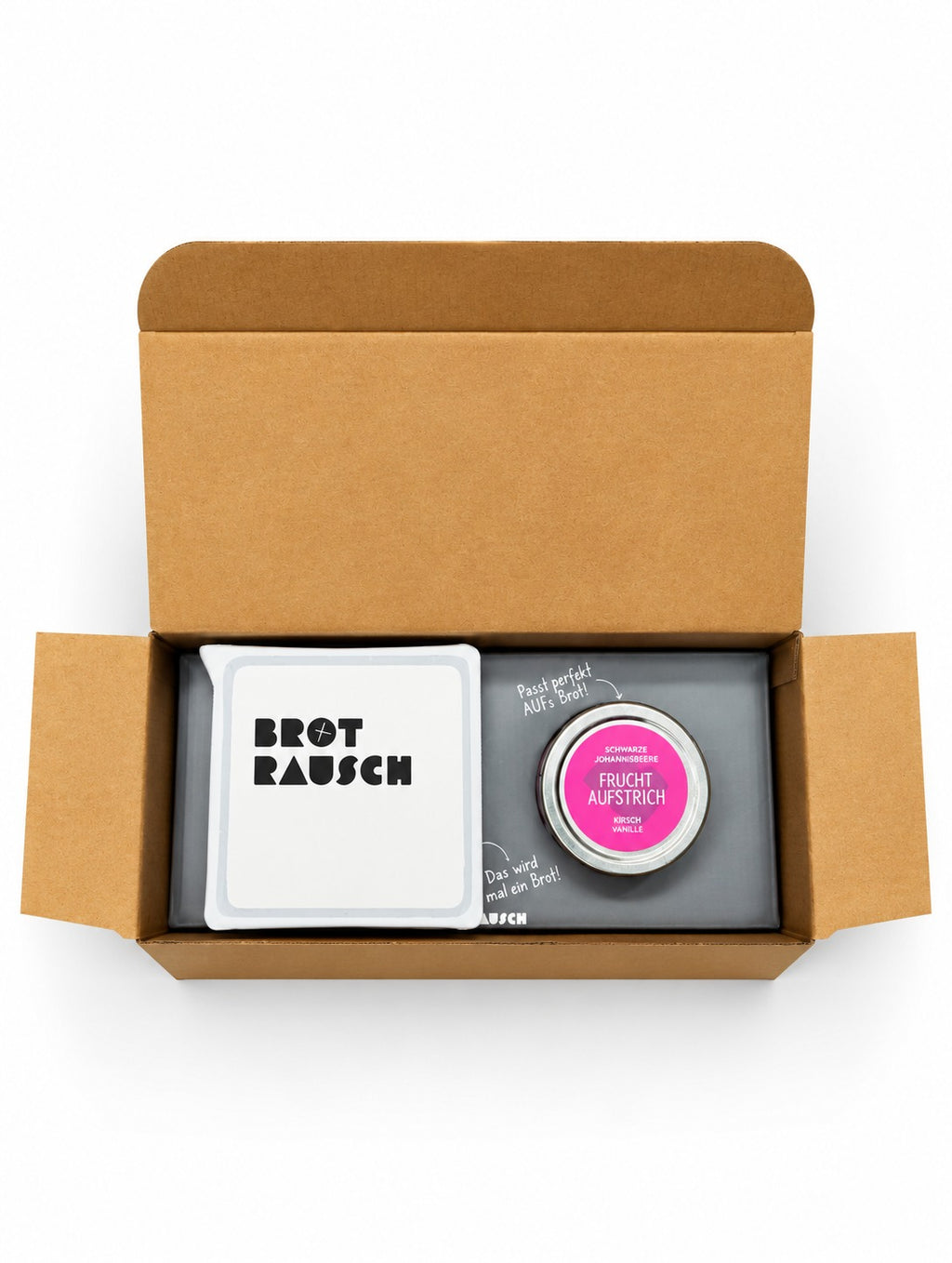 Brotrausch Geschenkbox mit Brotbackmischung und Fruchtaufstrich im geöffneten Versandkarton